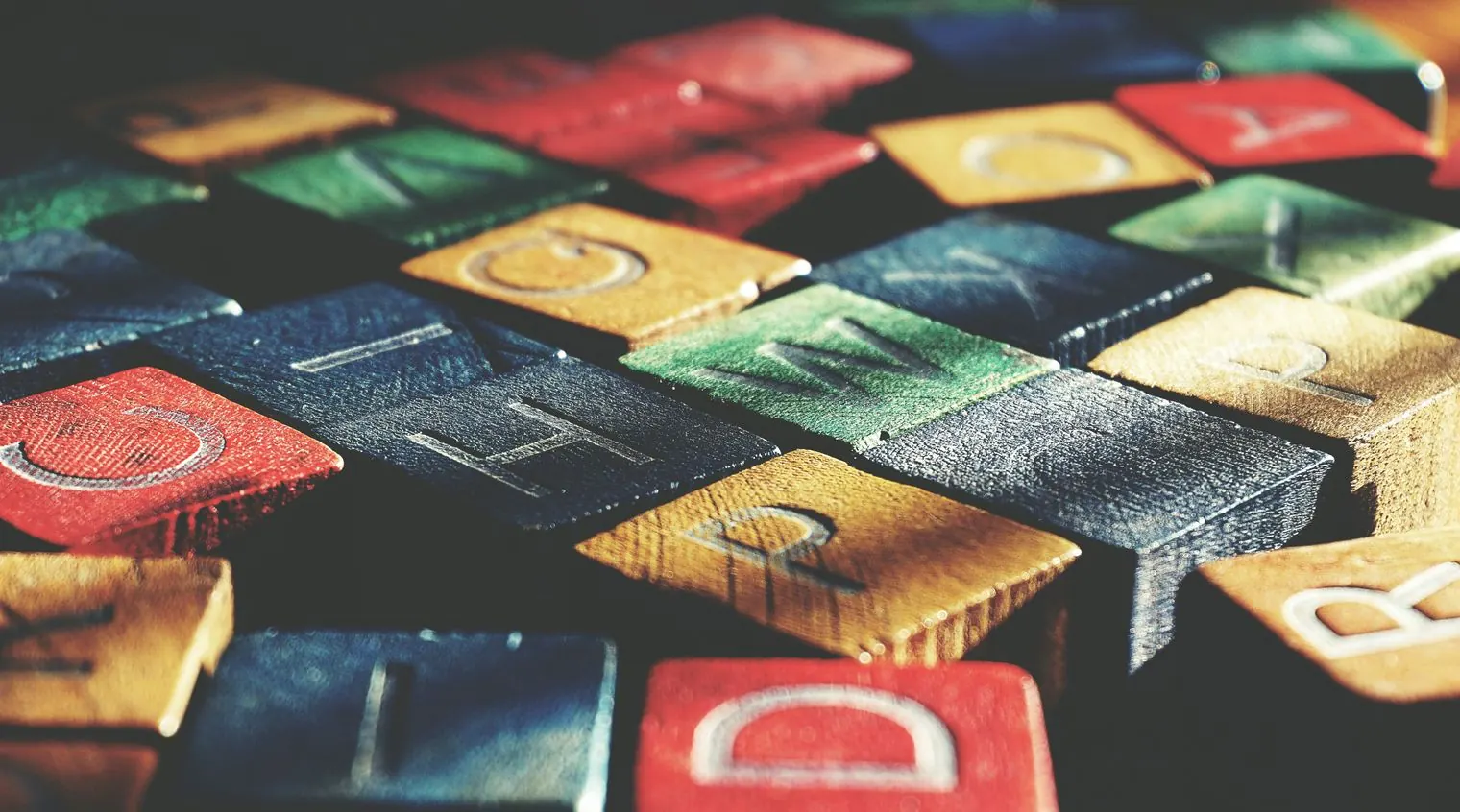 Wooden letter blocks scattered on a table